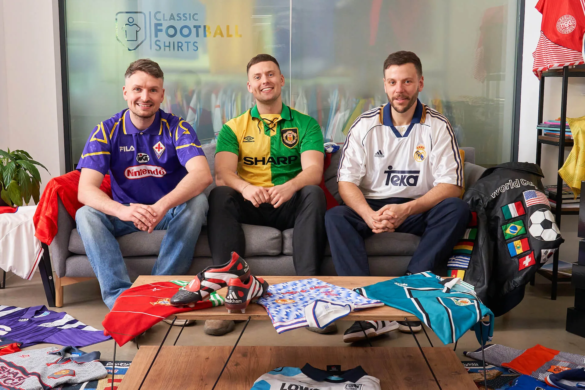 Three classic football shirt collectors wearing Fiorentina, Manchester United and Real Madrid retro jerseys